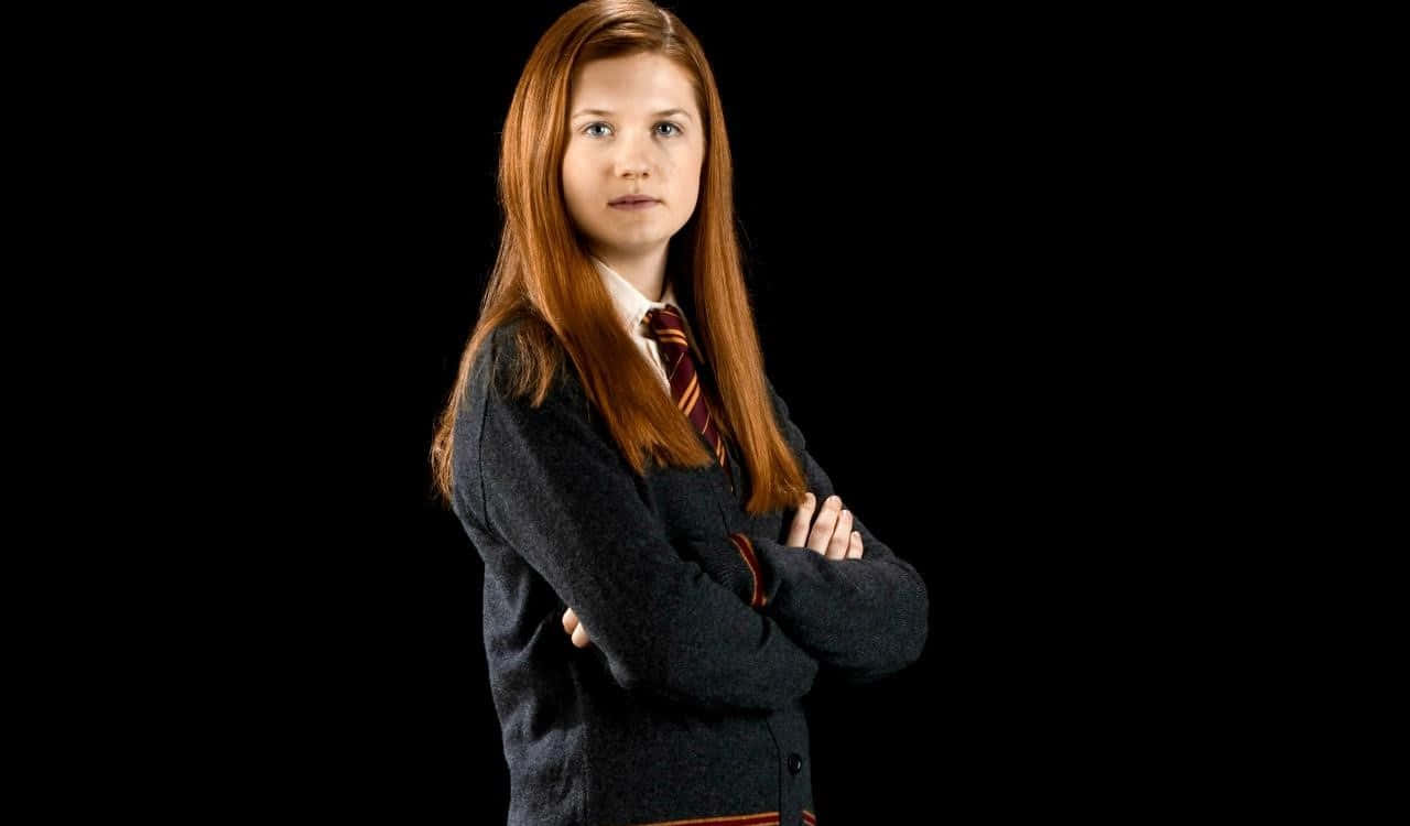 Ginny Weasley casting a spell at Hogwarts Wallpaper