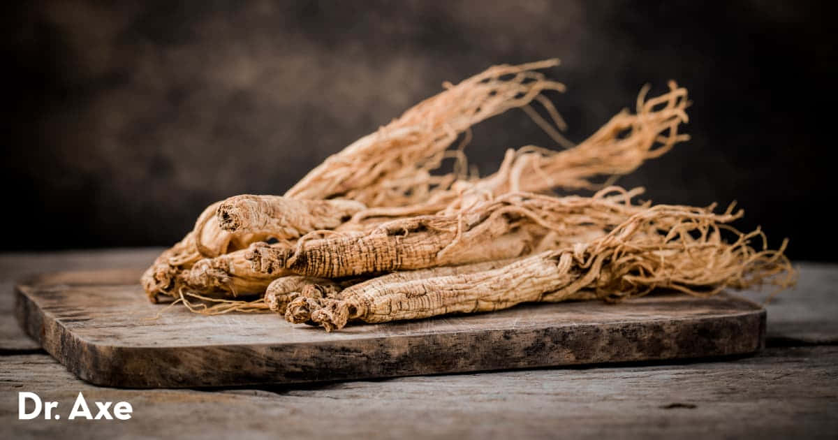 A Pile Of Ginseng On A Wooden Cutting Board