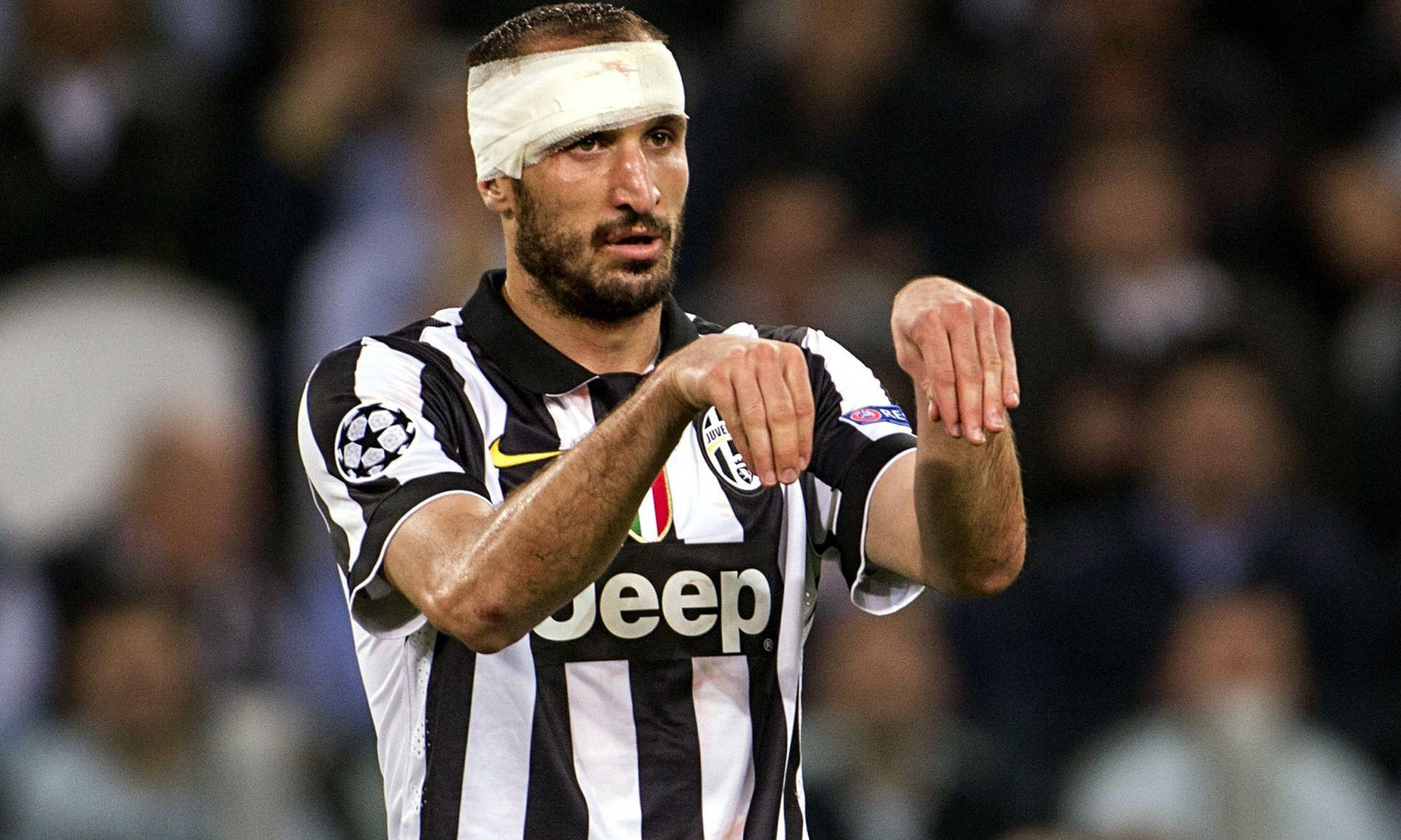 Giorgiochiellini Juventus Fc Lesión En La Cabeza Con Las Manos. Fondo de pantalla
