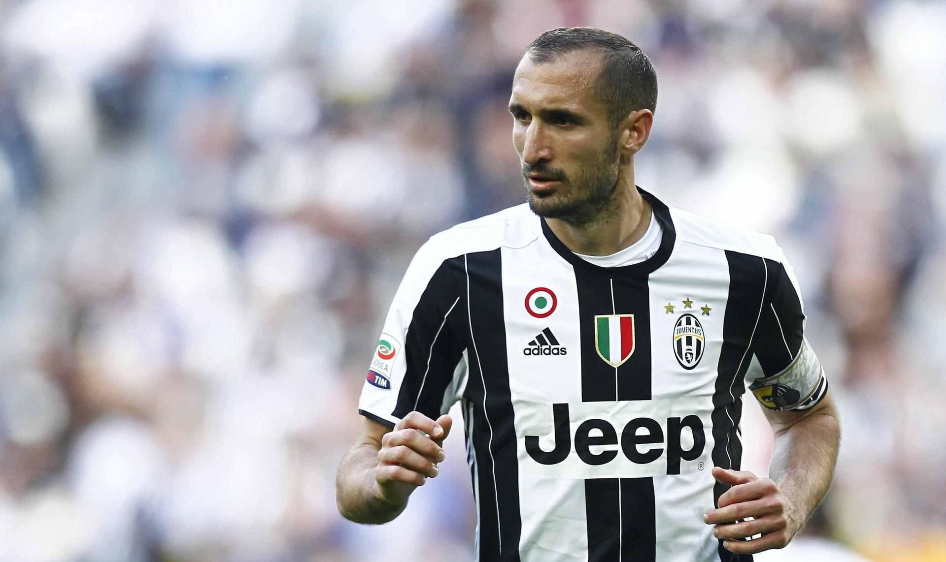 Giorgiochiellini Corriendo Jugador De Fútbol Del Juventus Fc Fondo de pantalla