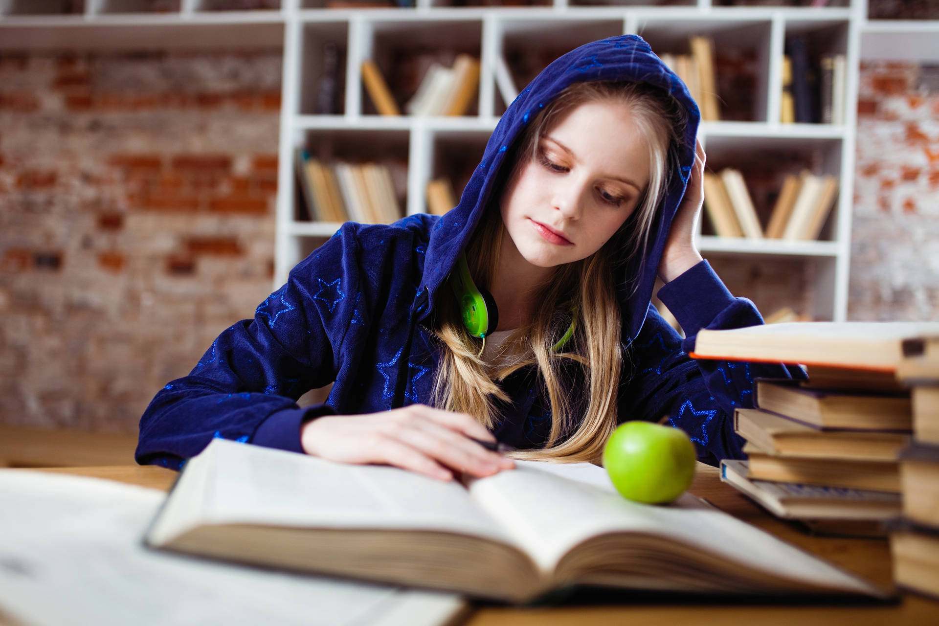 Girl In Hoodie Learning With Apple Wallpaper
