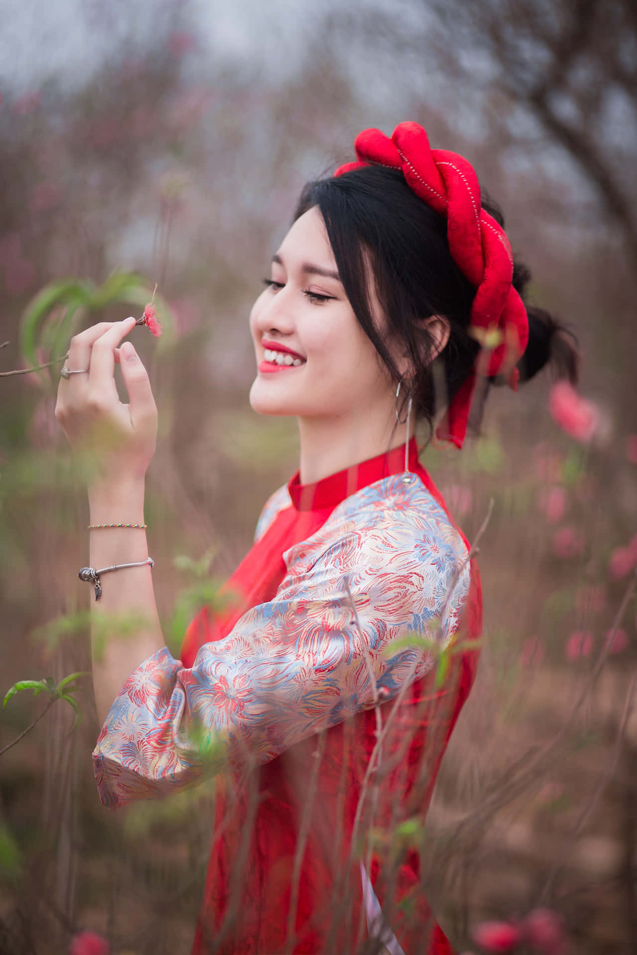 Girl Posing Holding A Flower Wallpaper
