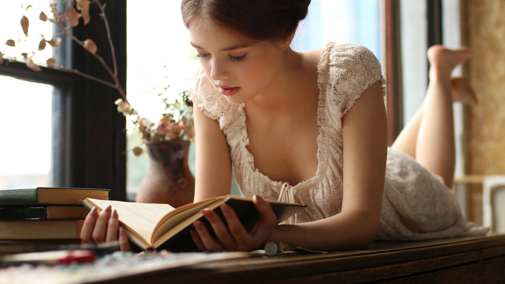 Girl Reading Books Near Window Wallpaper