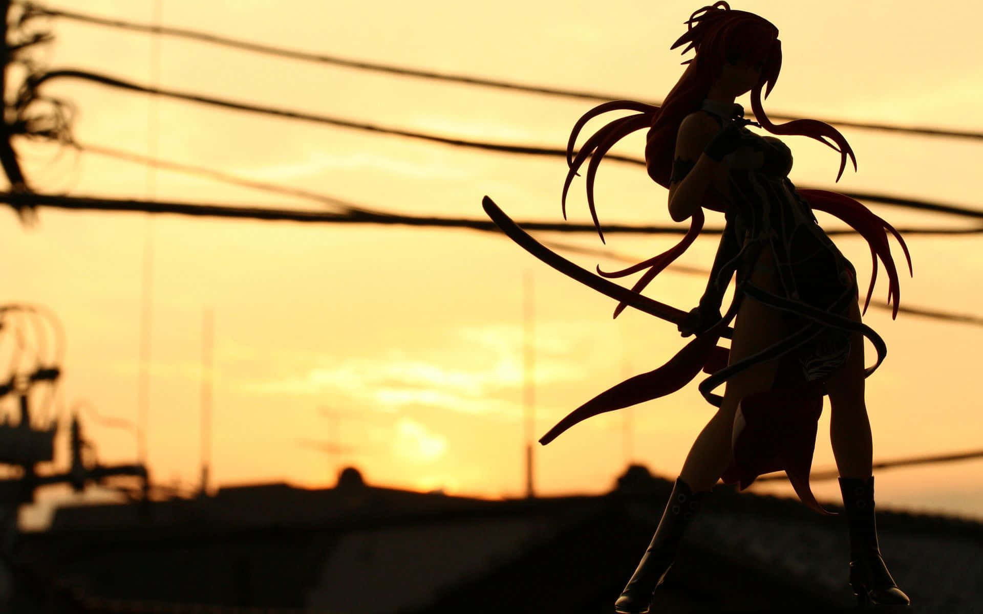 A beautiful girl stands in silhouette against a scenic background.