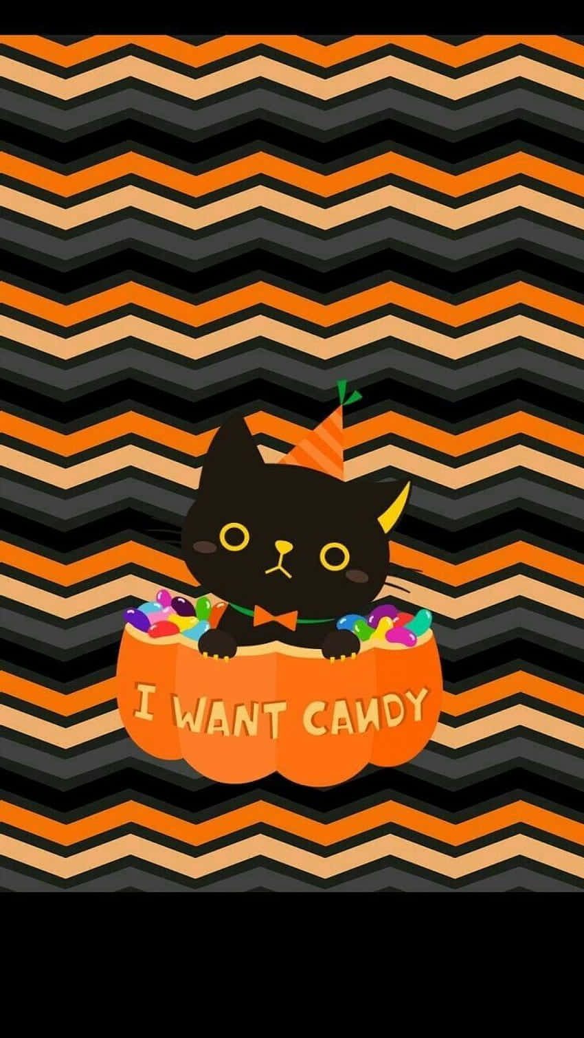 Einekatze In Einem Halloween-kostüm Mit Süßigkeiten Im Mund. Wallpaper