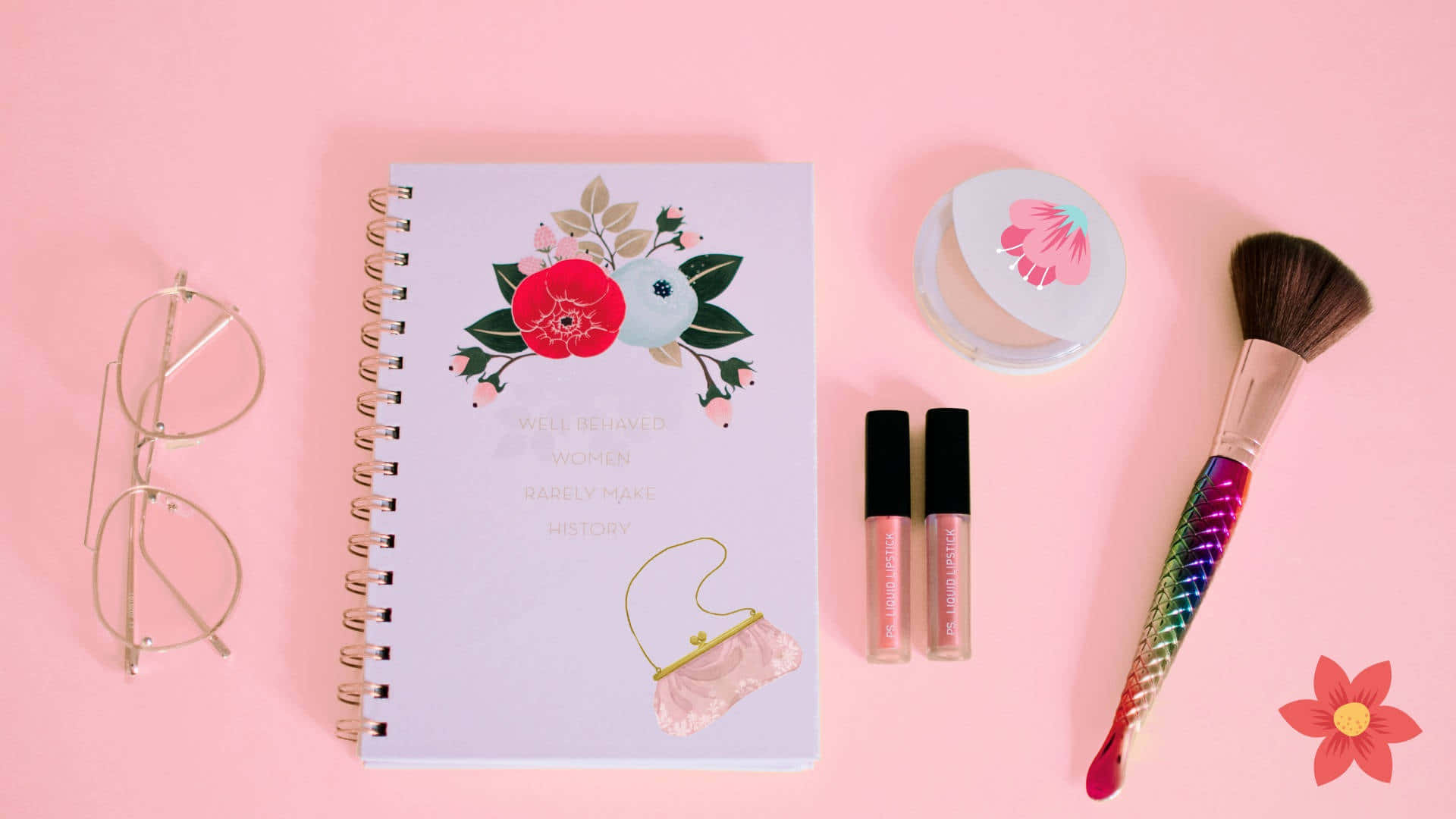 A Pink Notebook With Makeup Products And Eyeglasses Wallpaper