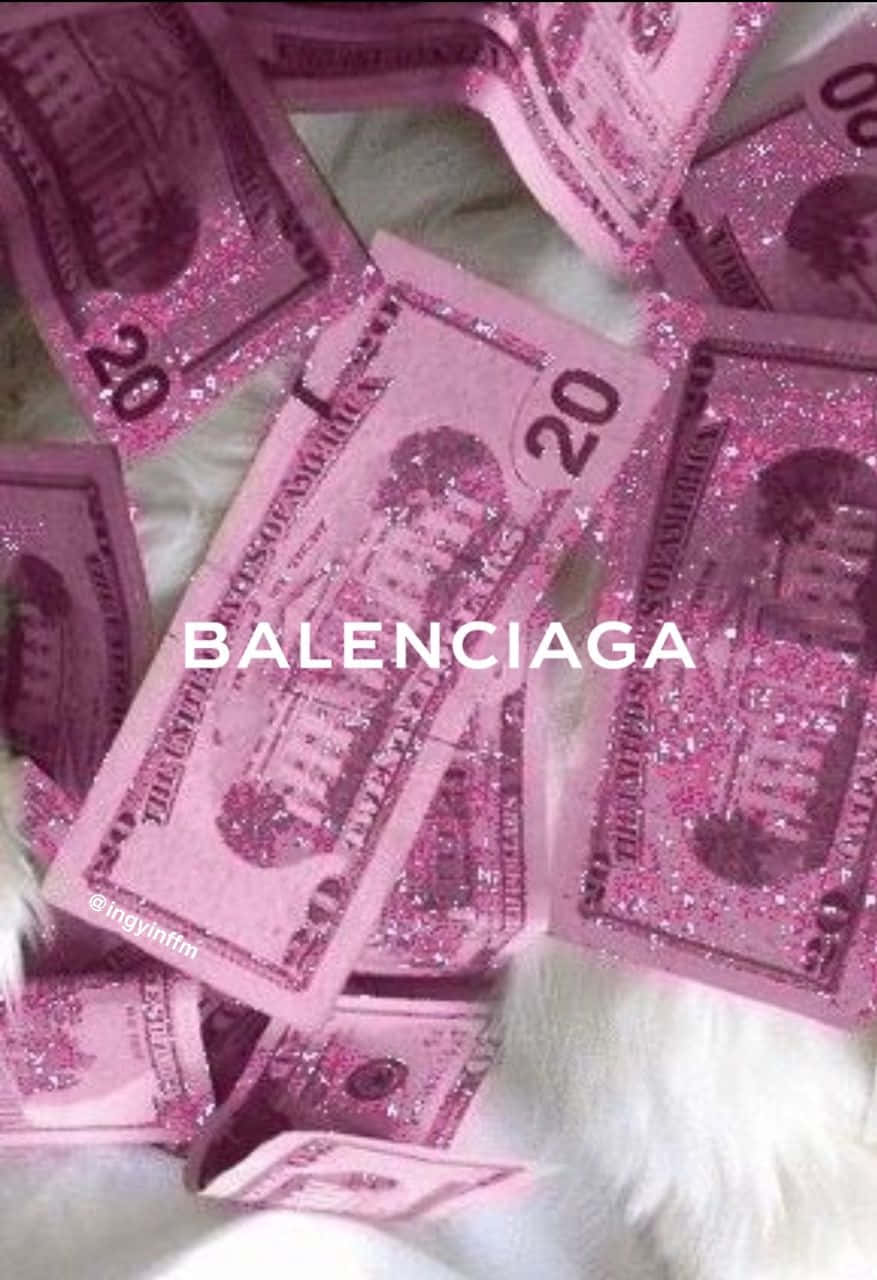 Balenciaga - en kat ligger på pink glitrende penge Wallpaper