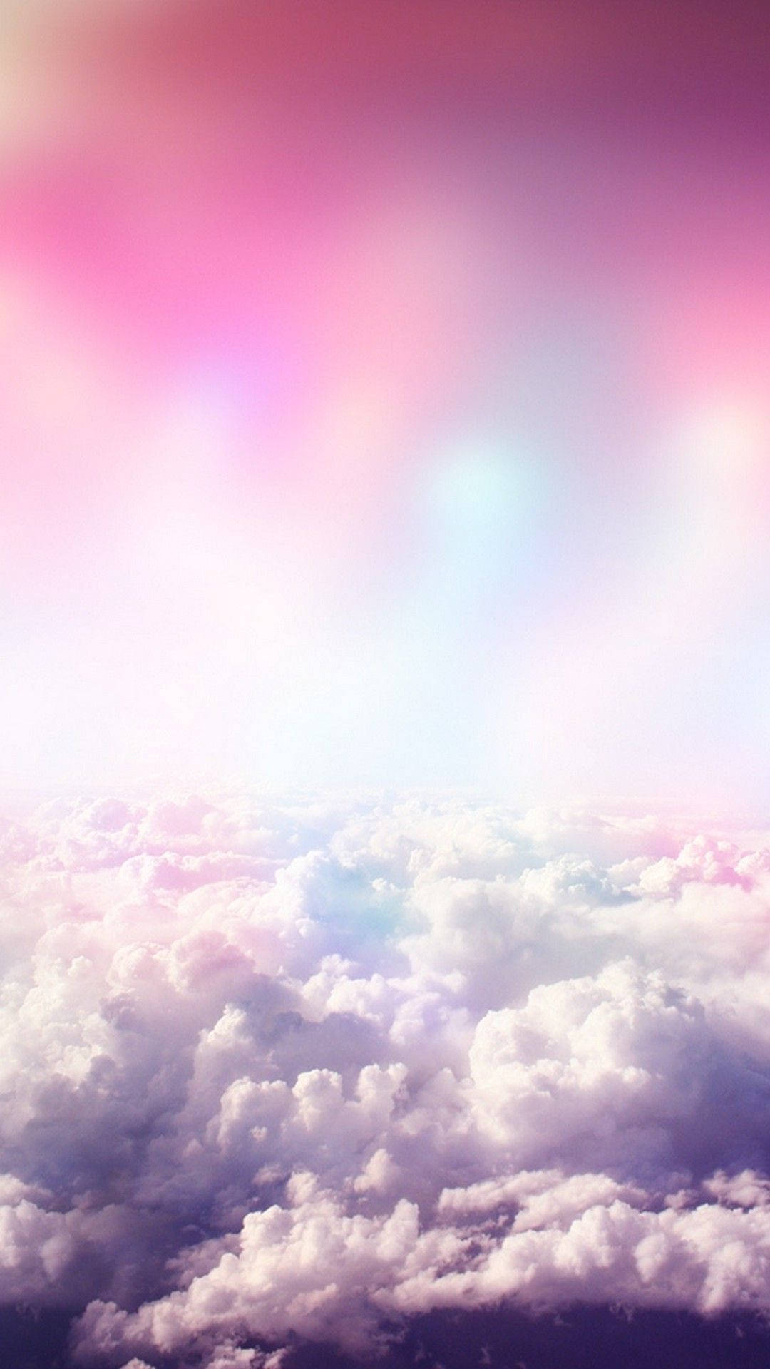A girly pink sky with fluffy, dreamy clouds Wallpaper