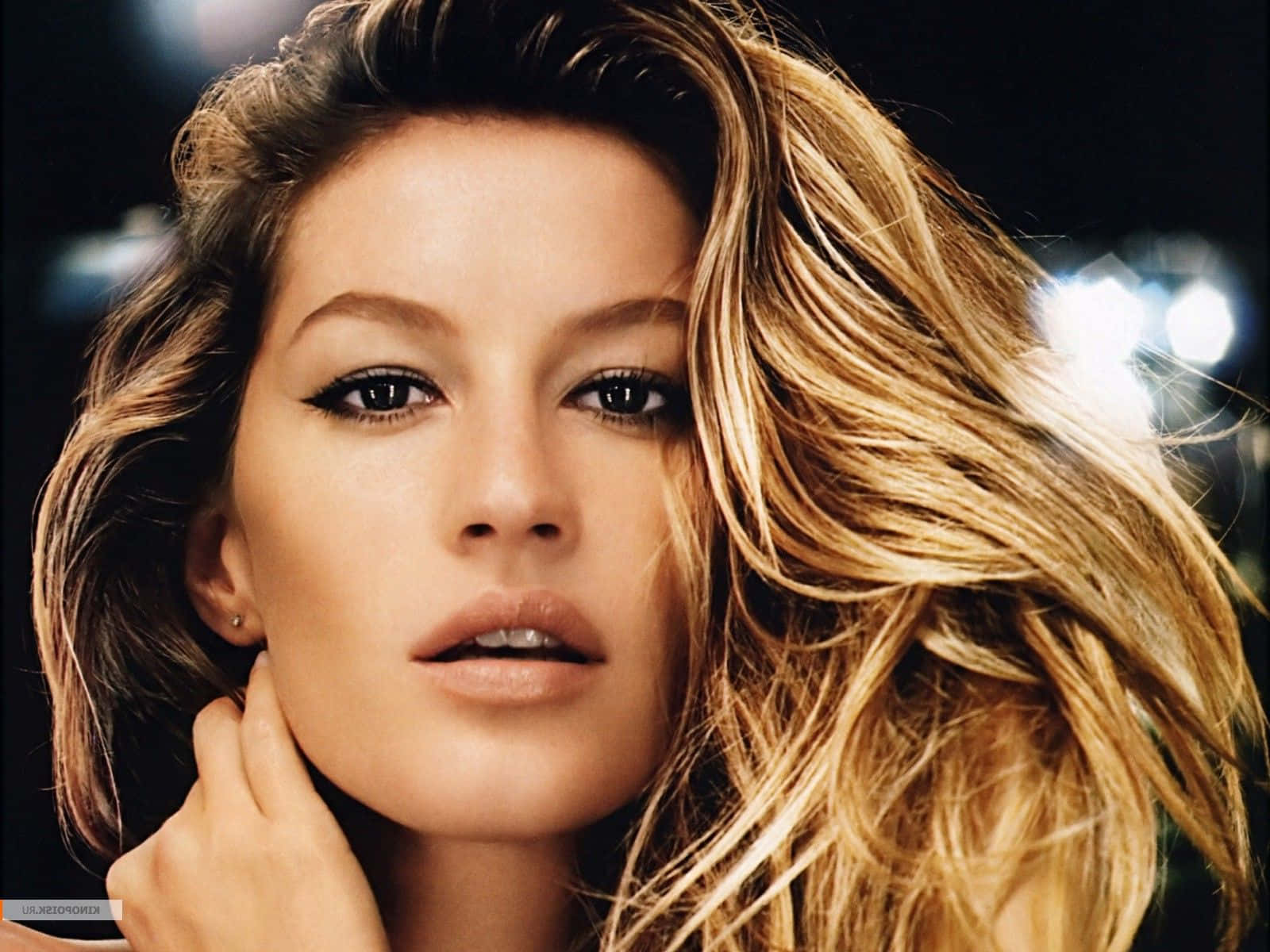 Gisele Bundchen Captivating In A Stylish Outfit Against A Neutral Background Wallpaper