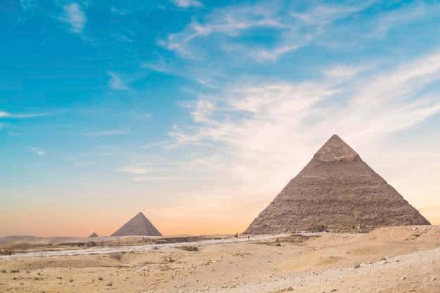 The Majestic View of the Giza Pyramids Under a Sublime Twilight Sky Wallpaper