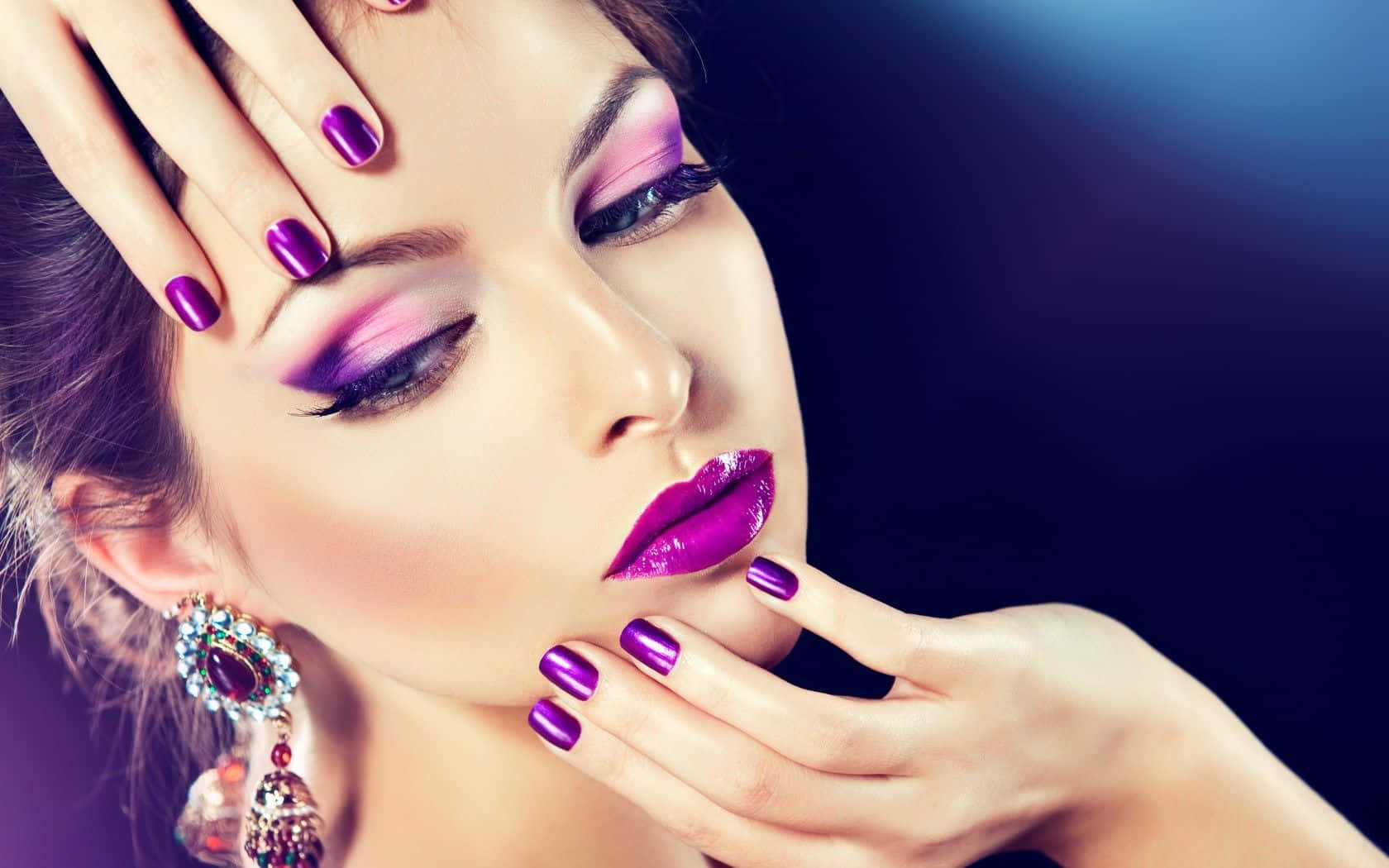 Glamorous Purple Makeupand Nail Art Wallpaper