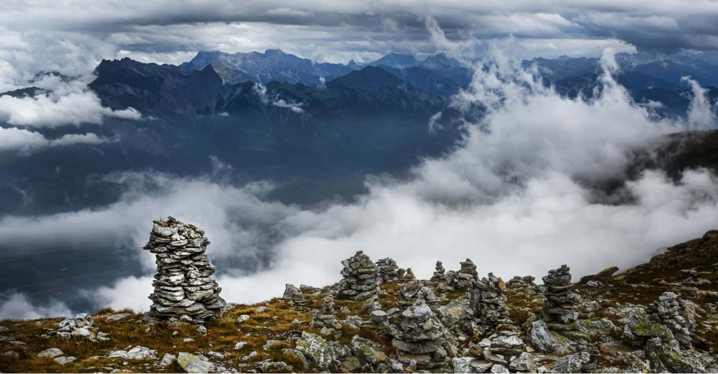 Glarus Mountain Clouds Stone Piles Wallpaper