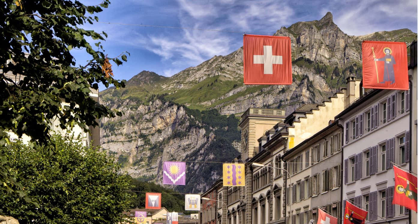Glarus Switzerland Street Viewwith Flags Wallpaper