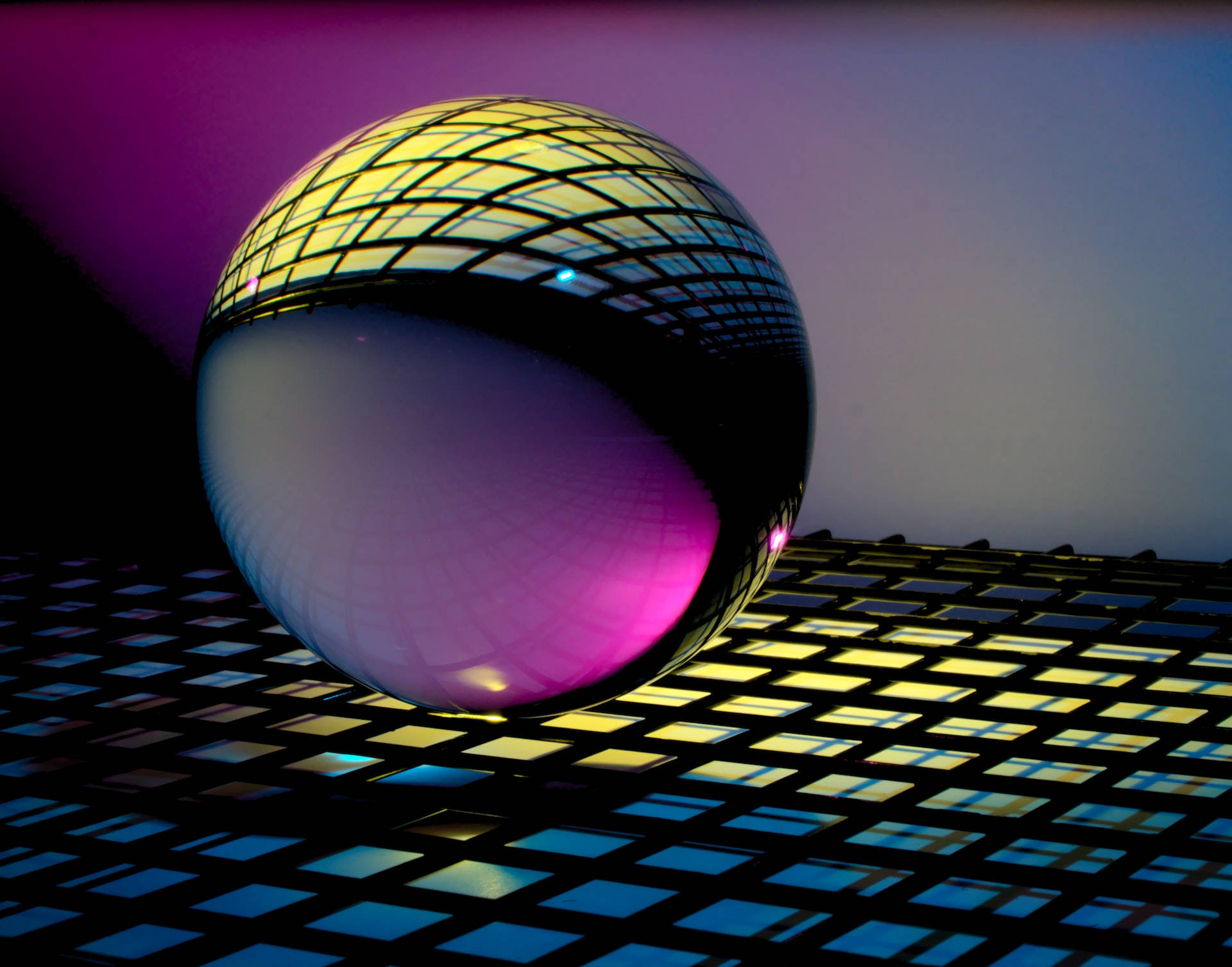 Mysterious Glass Orb on a Blue Checkered Background Wallpaper