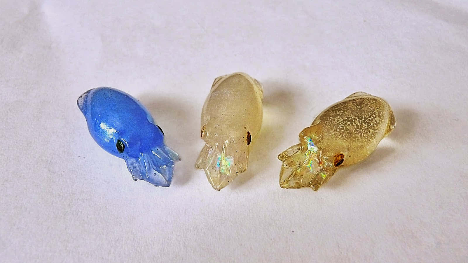 Glass Squid Figurines Display Wallpaper