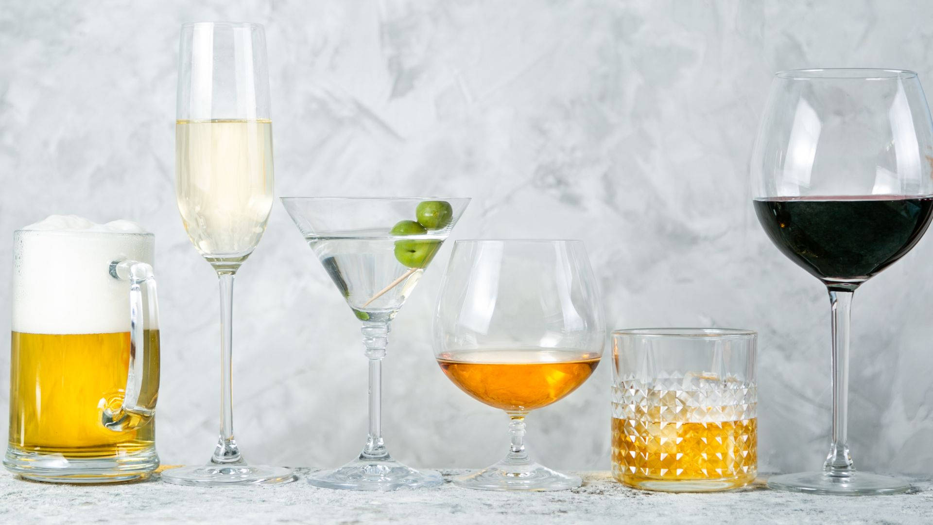 Glasses Of Alcohol On White Marble Picture