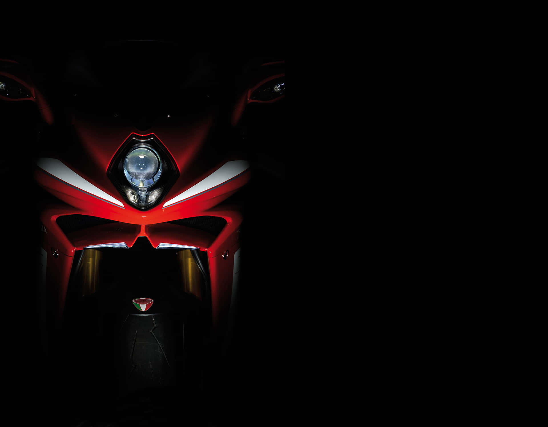 Gleaming Mv Agusta Motorcycle In Spotlight Wallpaper