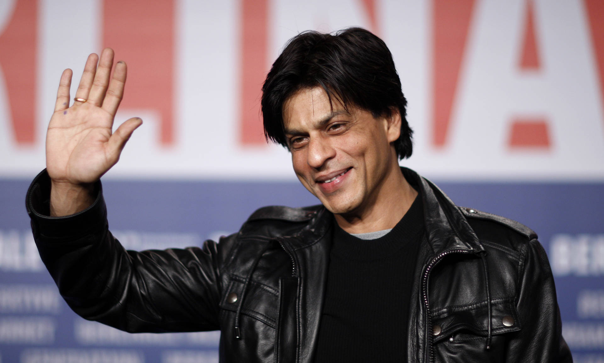 Glade Shah Rukh Khan-ikoner bevæger sig over skærmen. Wallpaper