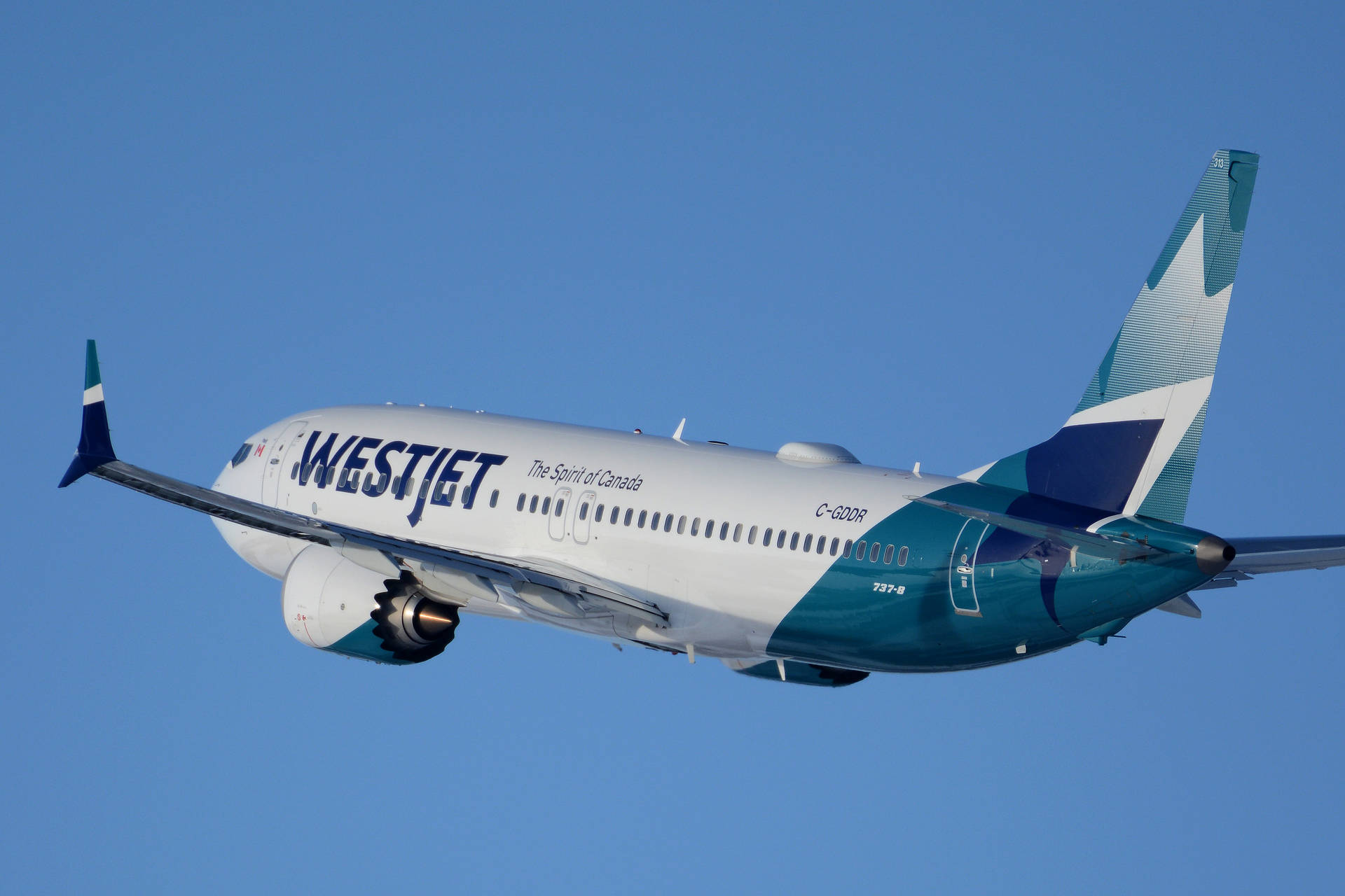 Aviónde Westjet Airlines Deslizándose. Fondo de pantalla