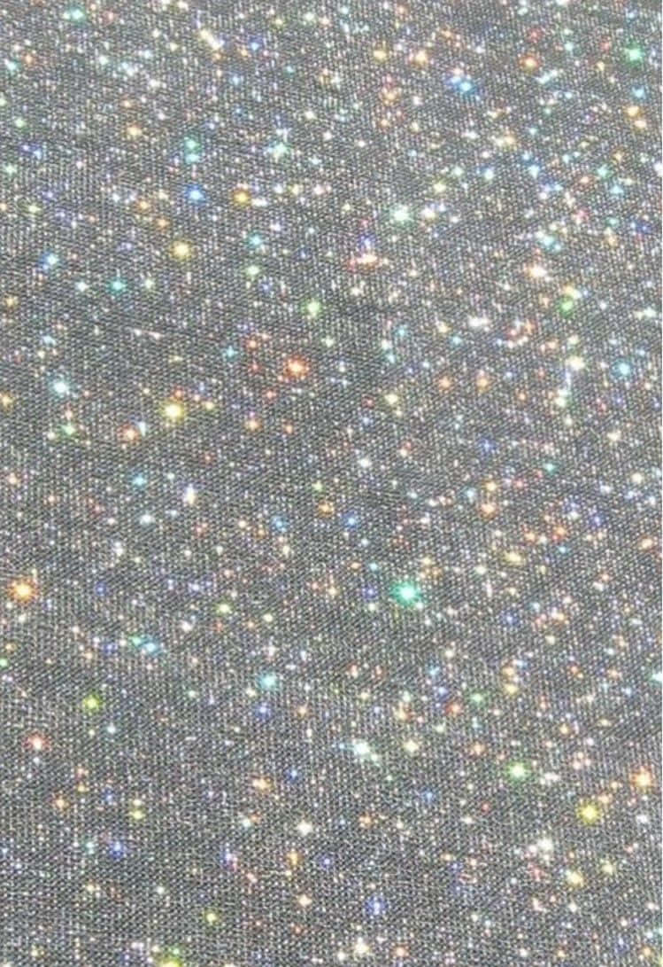 Einenahaufnahme Von Schwarzem Stoff Mit Mehrfarbigen Sternen Wallpaper