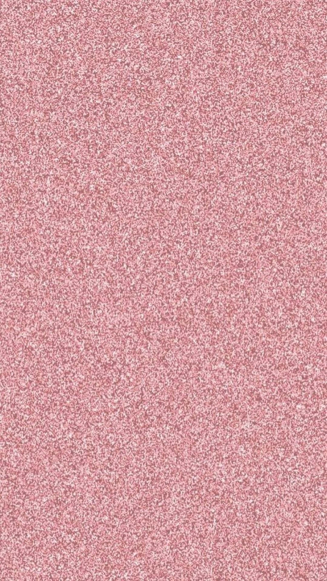 A Pink Glittery Background With Small White Dots