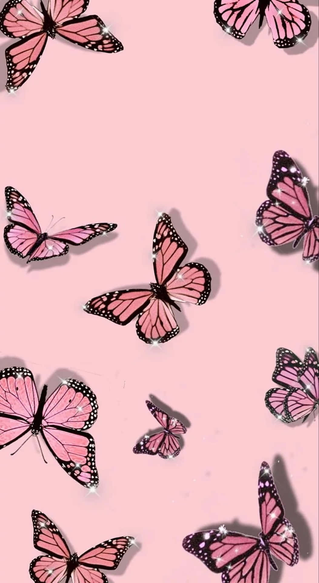 Glittering Pink Butterflieson Pastel Background Wallpaper
