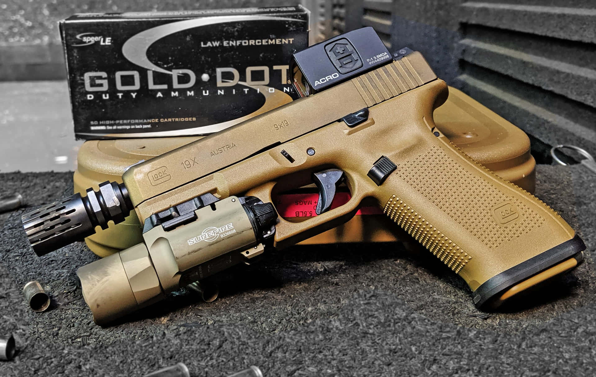 A Glock Glock 17 With A Box Of Ammo
