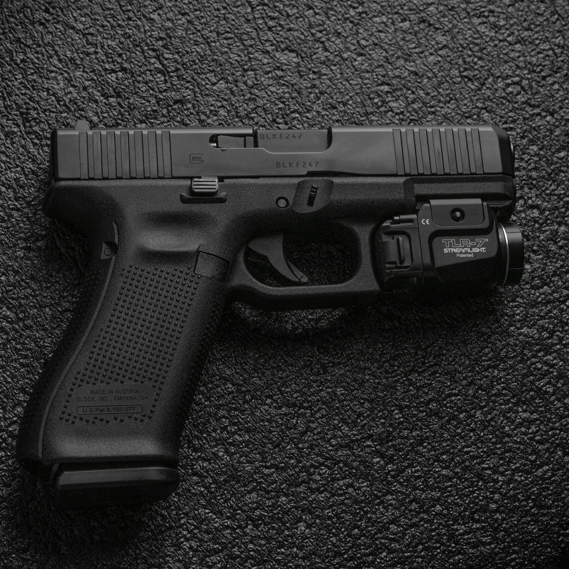 Glock On Black Concrete Surface Picture