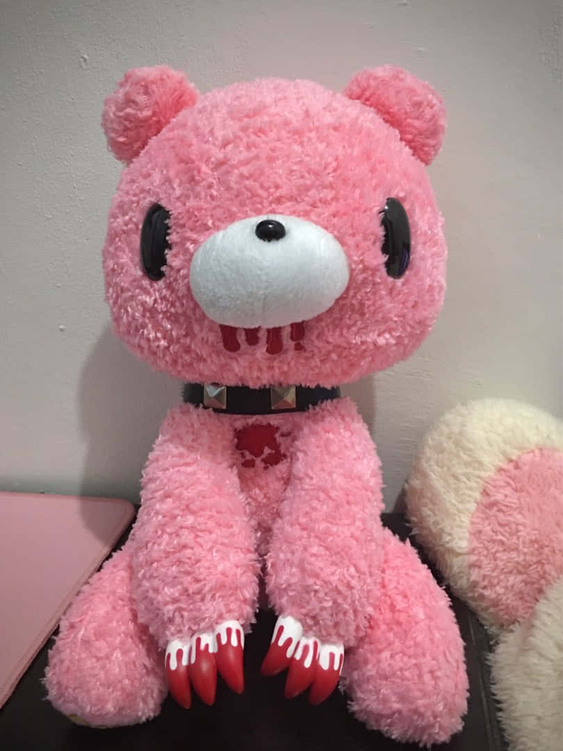 A Pink Stuffed Animal With Claws On Its Face Wallpaper