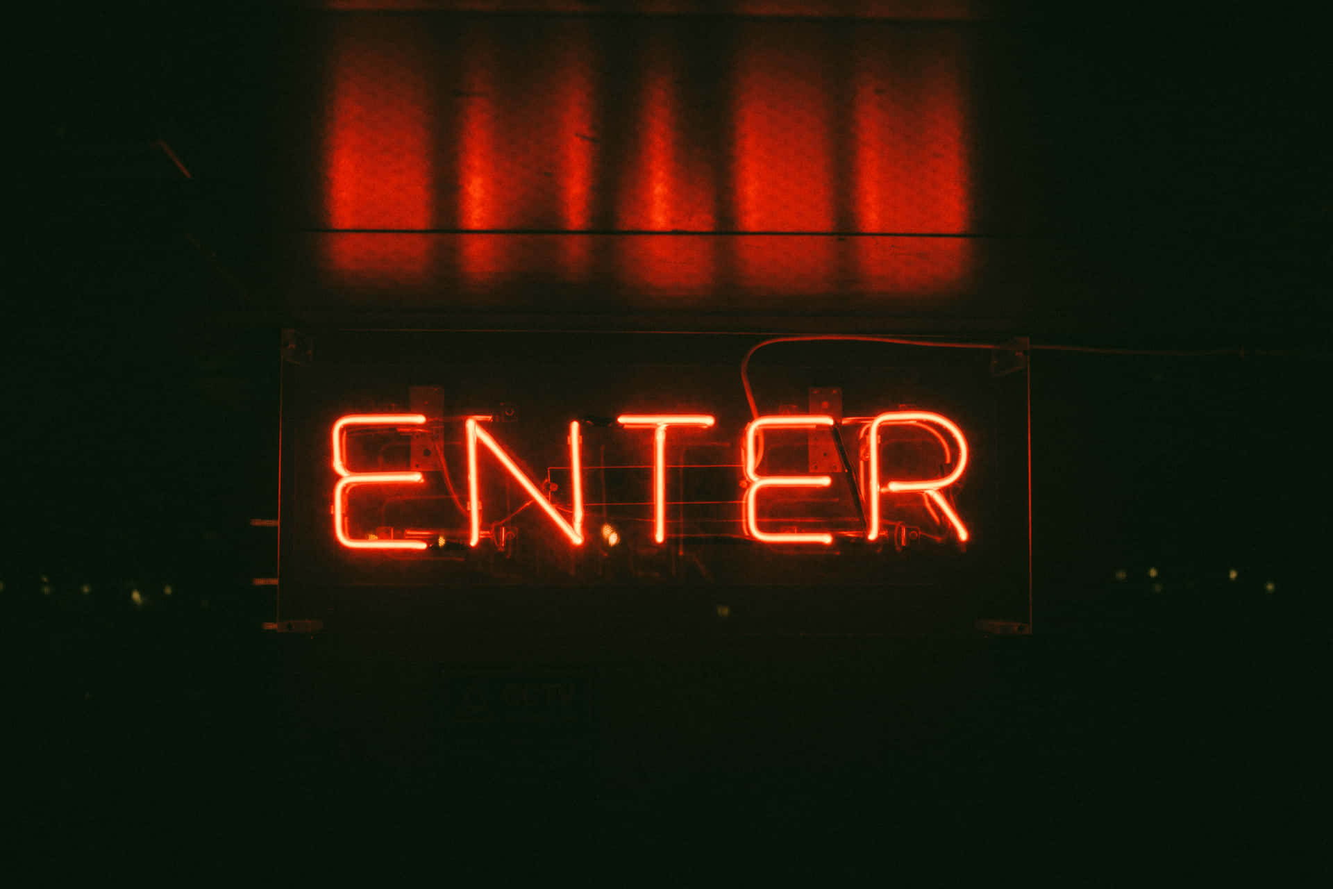 A Neon Sign That Says Enter