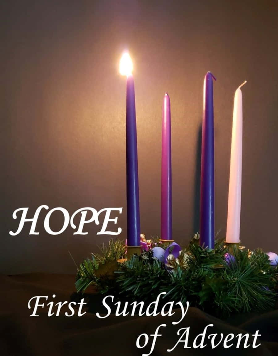 Glowing Advent Candles Signifying Hope Wallpaper