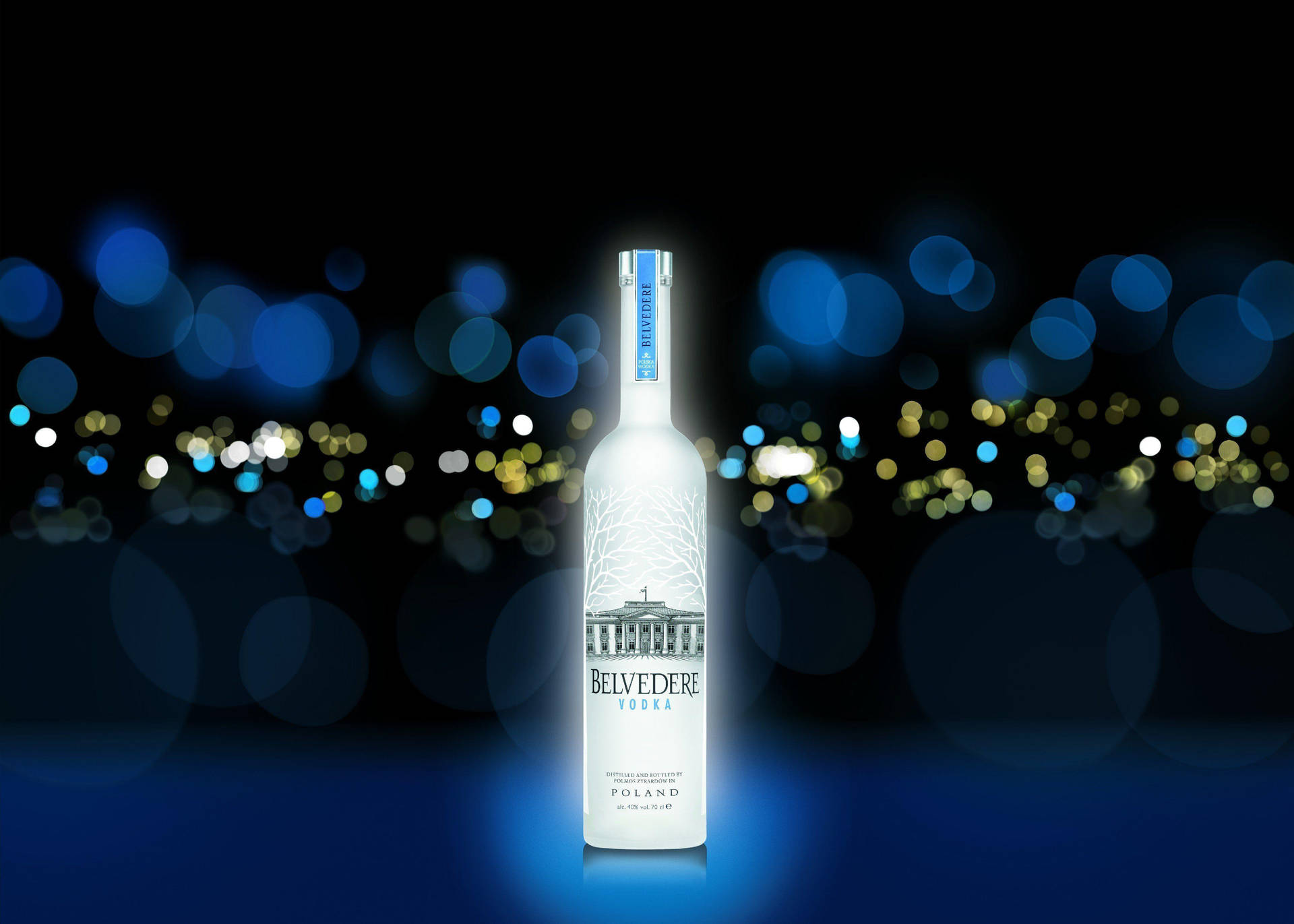 Glowing Belvedere Vodka At Night Wallpaper