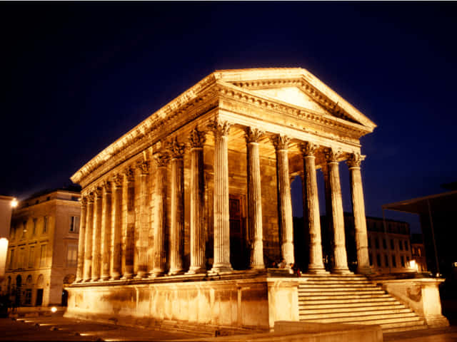 Glowing Maison Carrée At Night Picture