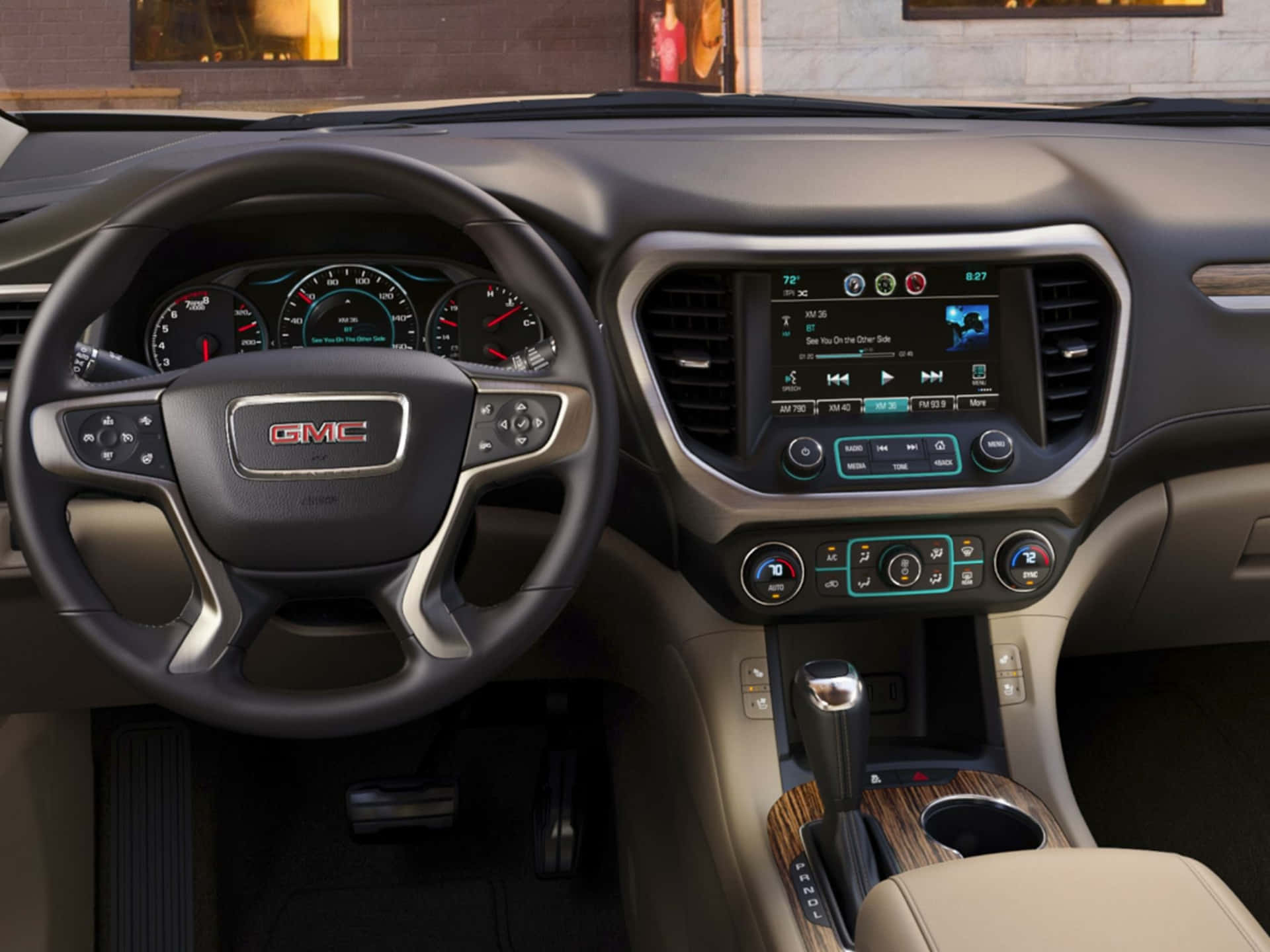 Stunning GMC Acadia showcasing its sleek design and powerful presence on the road. Wallpaper