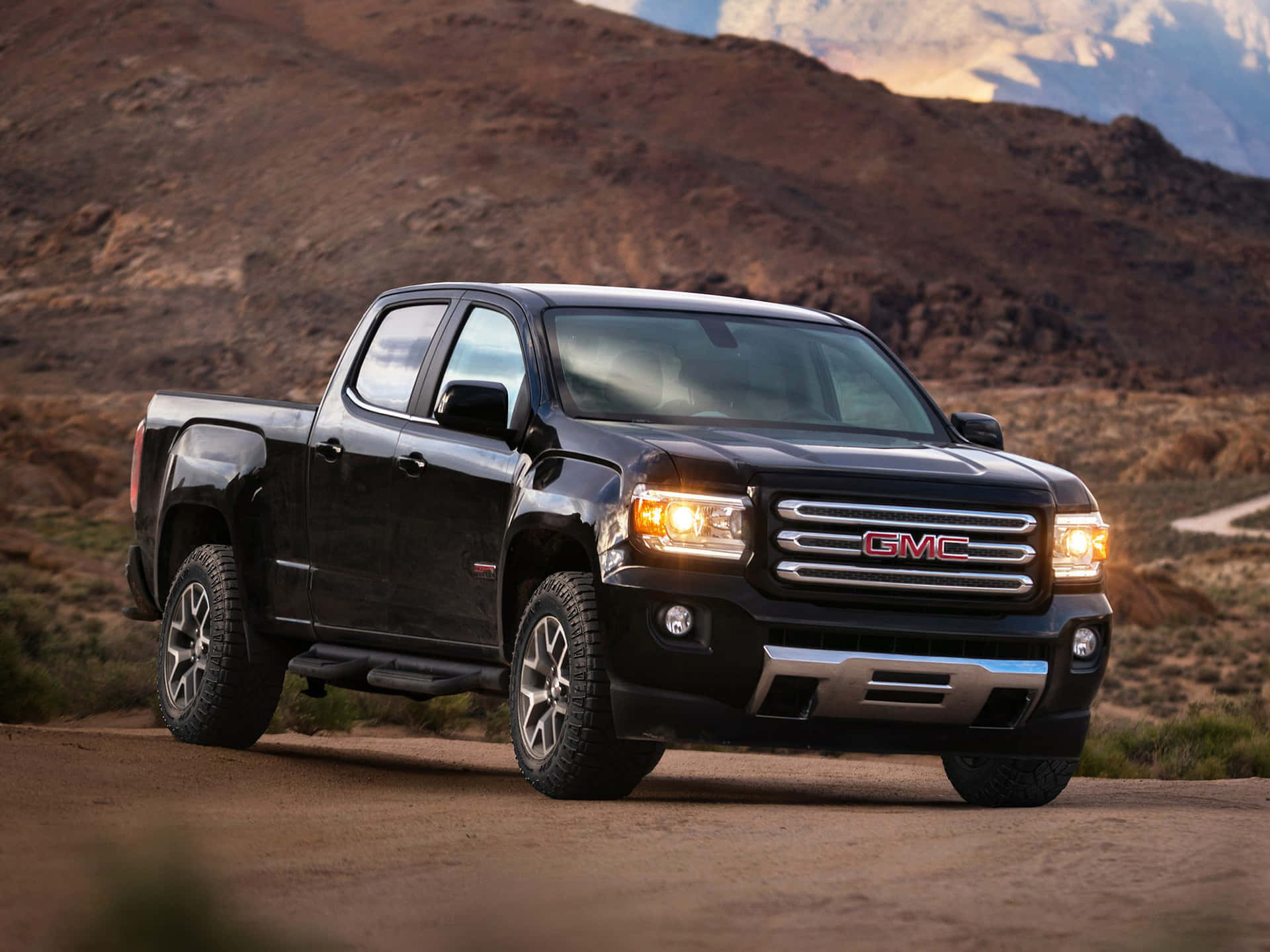 Sleek and Rugged GMC Canyon on the Road Wallpaper