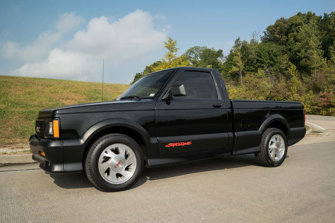 Caption: A Stunning Red GMC Syclone In Action Wallpaper