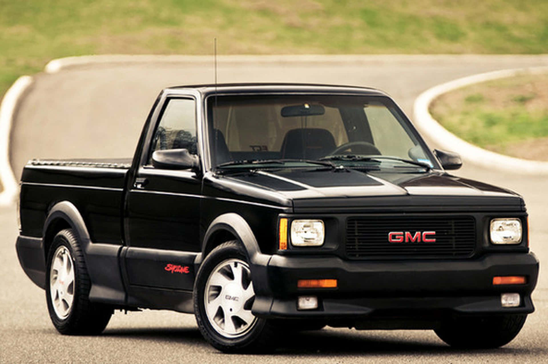 Caption: GMC Syclone 1991 - A Classic High-Performance Truck Wallpaper