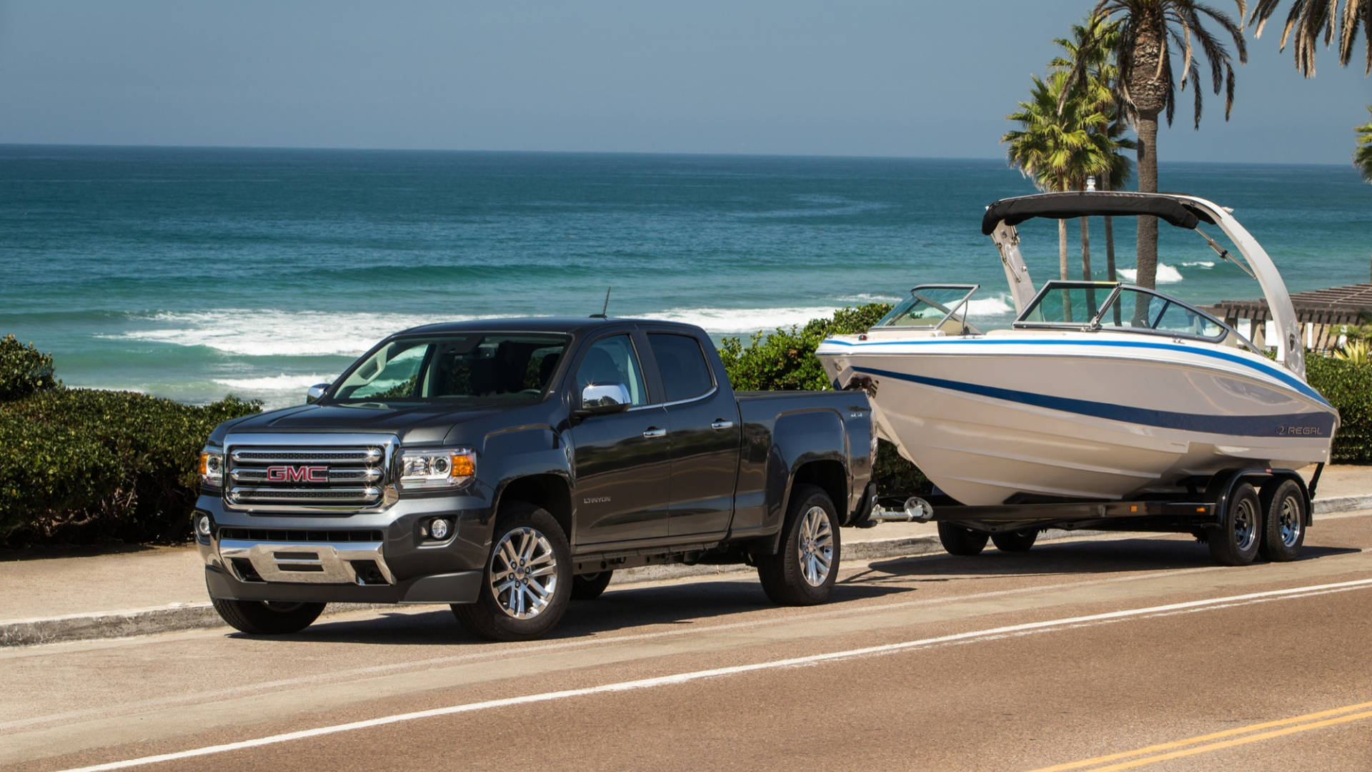 Gmc Vehicle And A Motor Boat