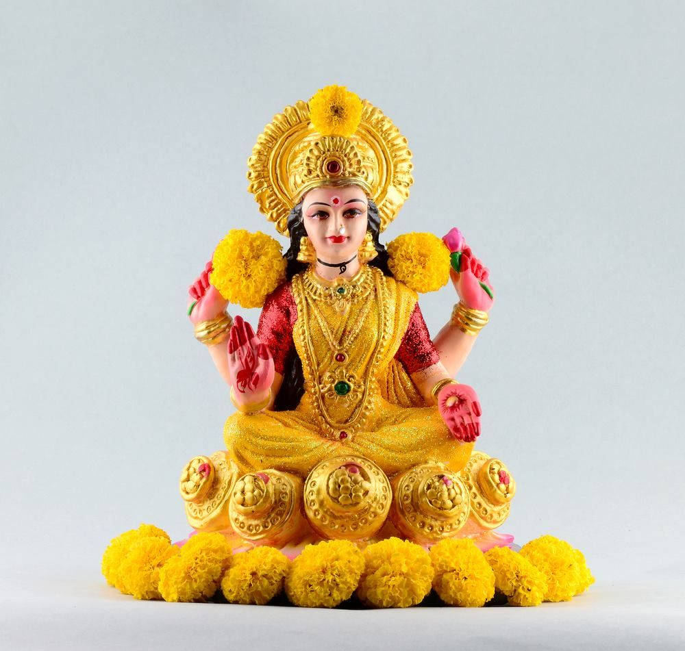 Goddess Lakshmi With Yellow Flowers Hd Wallpaper