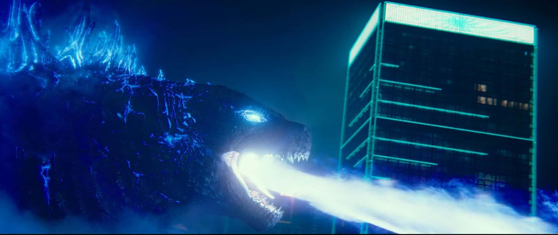 Godzilla unleashes its iconic atomic breath in a stunning display of power Wallpaper
