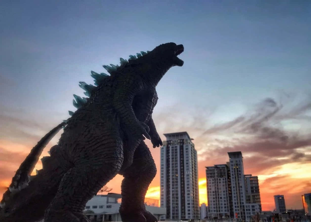 Immaginedi Godzilla Sopra Gli Edifici Durante Il Tramonto