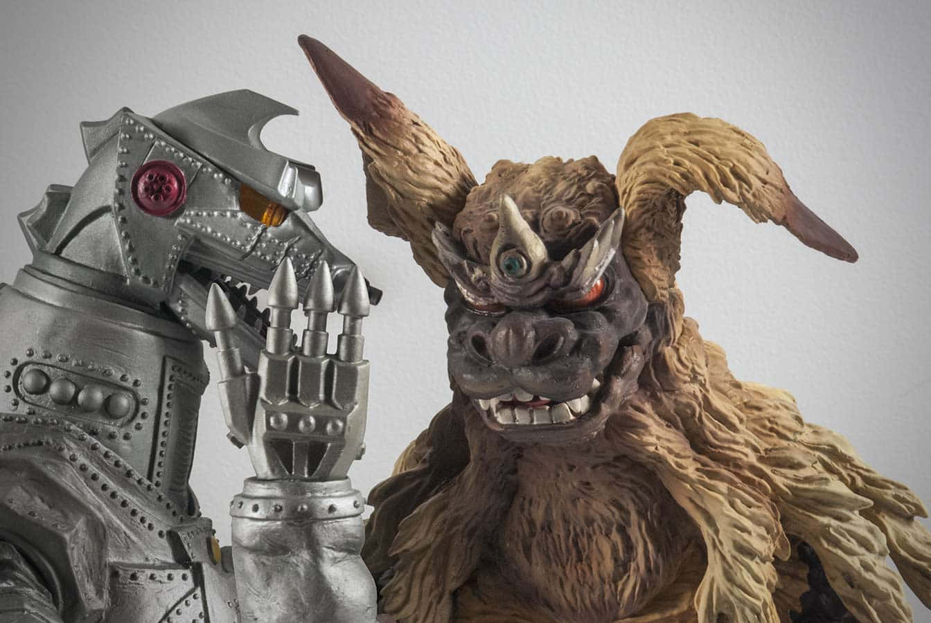 Godzilla Vs King Caesar Figuren Achtergrond