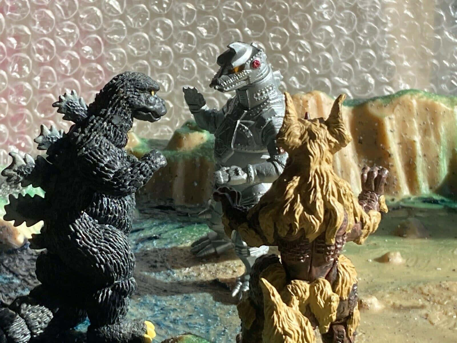 Godzilla Vs King Caesar En Mechagodzilla Speelgoed Battle Achtergrond