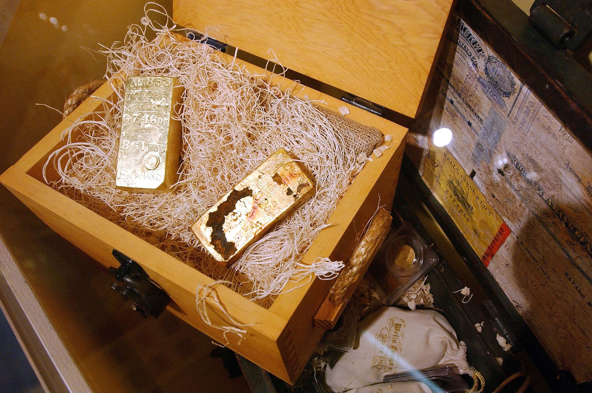 A Wooden Box With Gold Bars