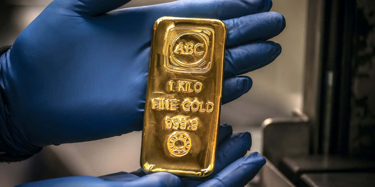Image  Gold bars gleaming against a black background