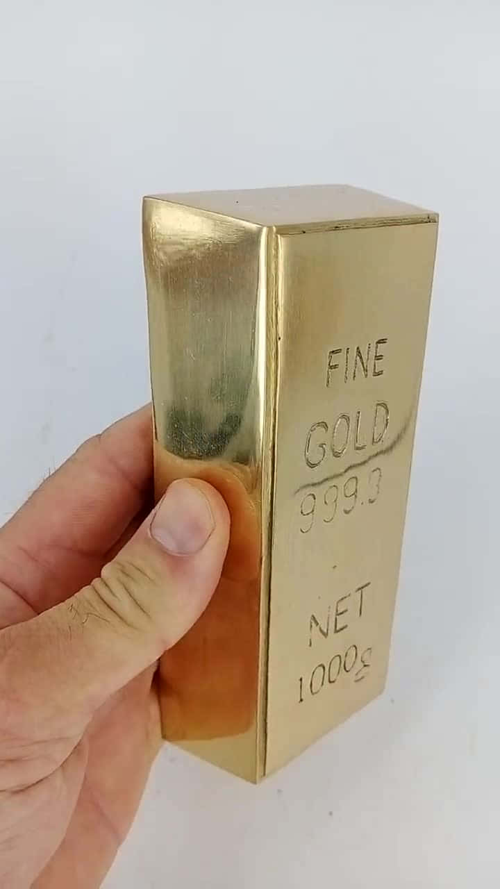 A pile of gleaming Gold Bars shows the value of gold
