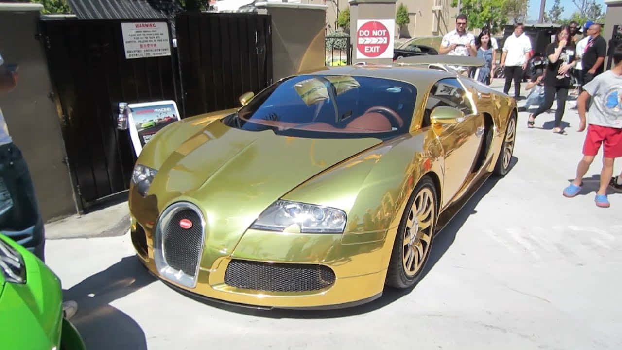 Make a Big Impression with this Limited Edition Gold Bugatti Veyron Wallpaper