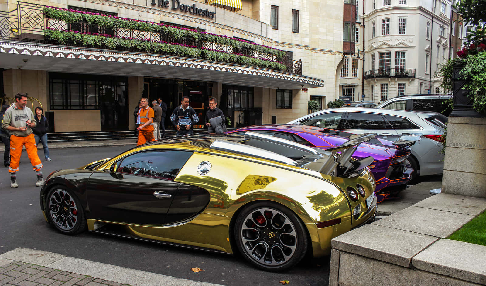 A Gold And Purple Bugatti Veyron Parked On The Street Wallpaper