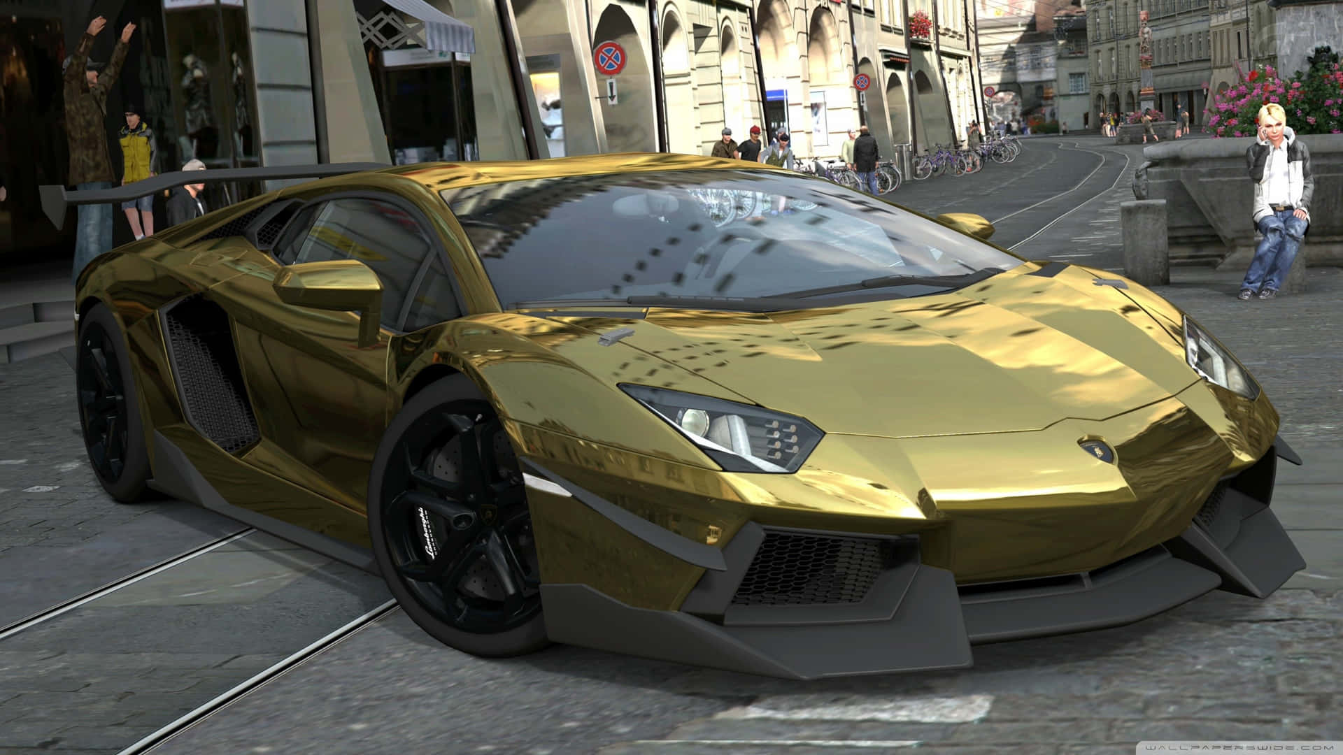 En guldbil er parkeret på gaden. Wallpaper