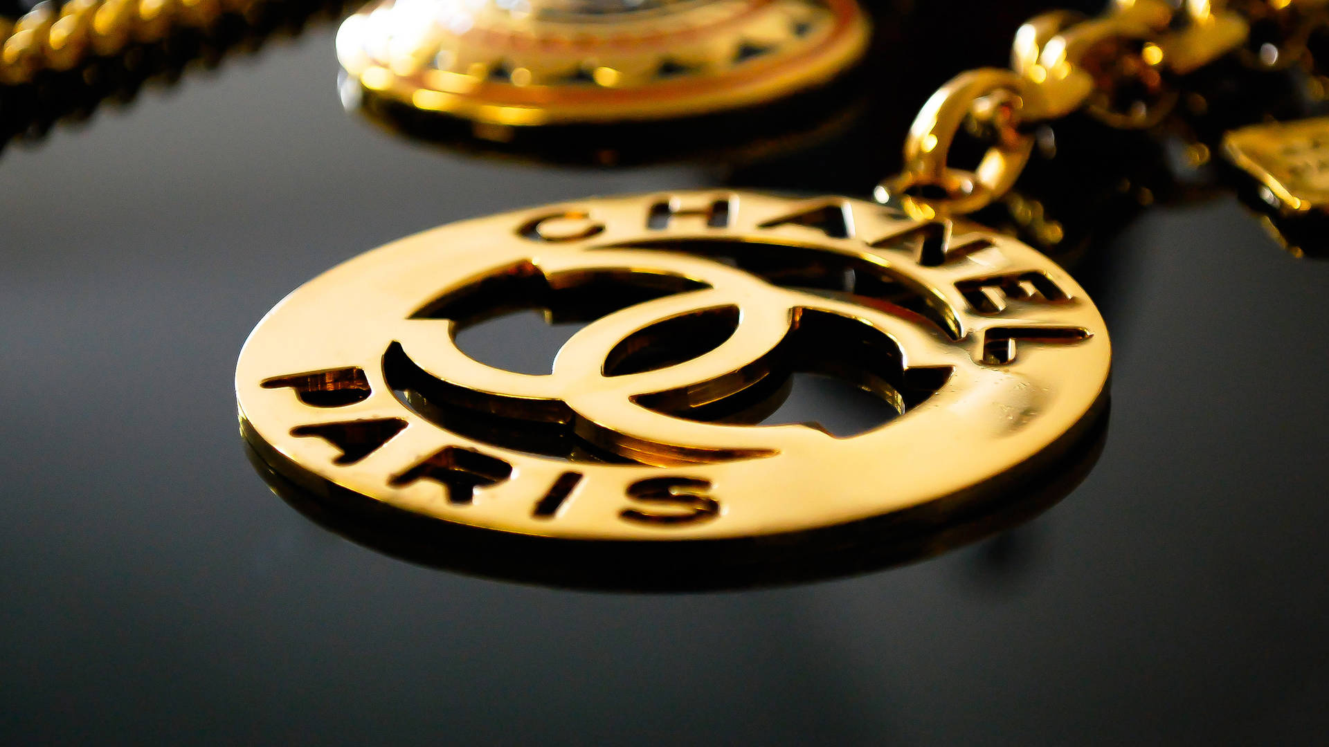 Gold Chanel Logo Pendant
